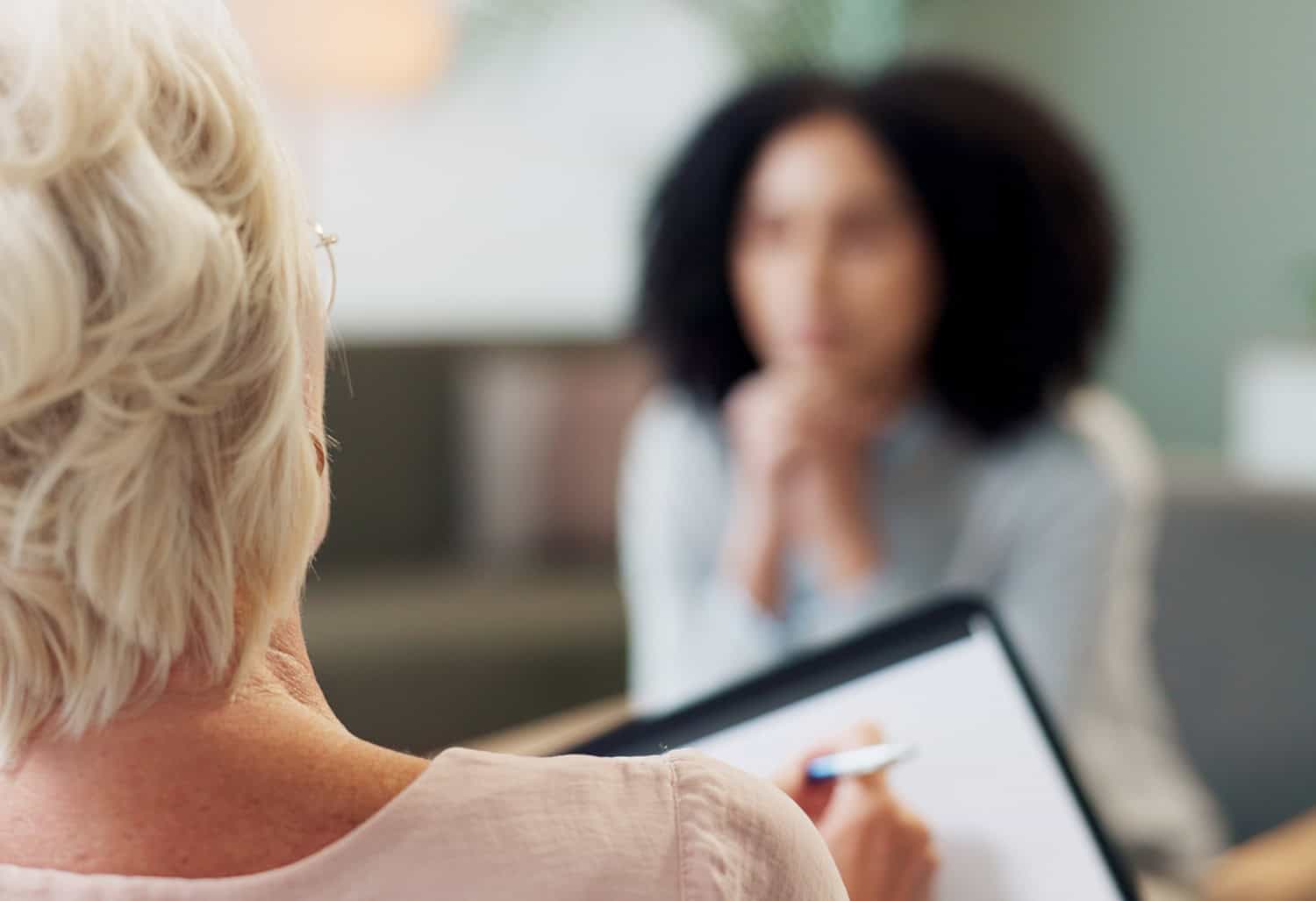 blurry image of woman during a mental health counseling session, concept of recovery